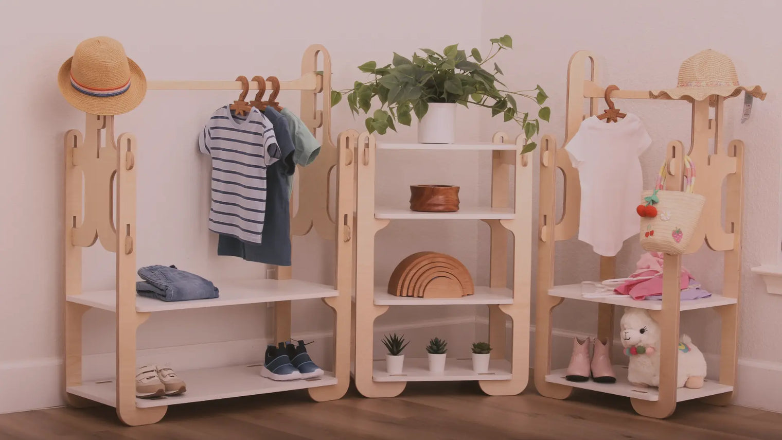 A display of Montessori wooden wardrobes and a Montessori 4-tier shelf made by Dannico