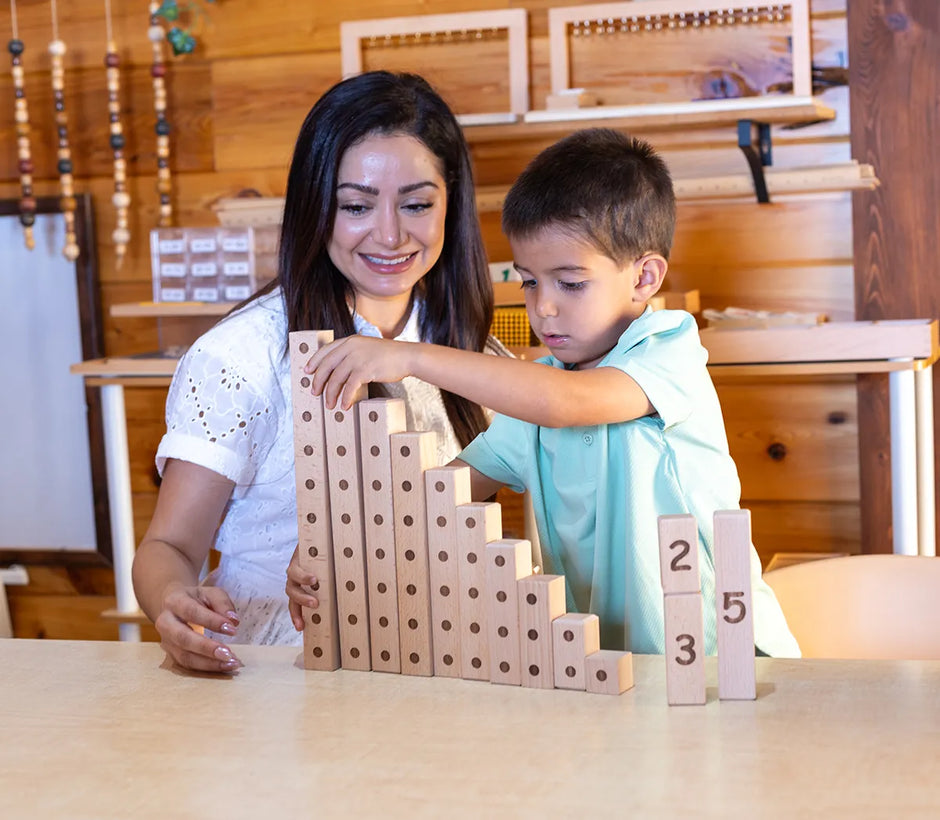 Adult and child playing with number blocks