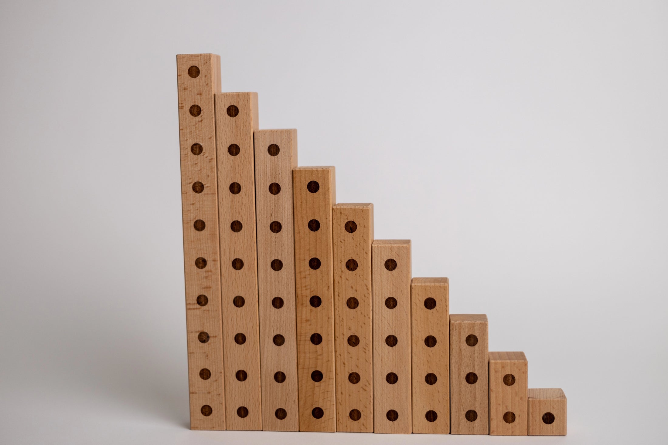 Stack of wooden blocks with engraved dots