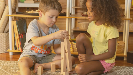 Two children playing different activities using Montessori number blocks