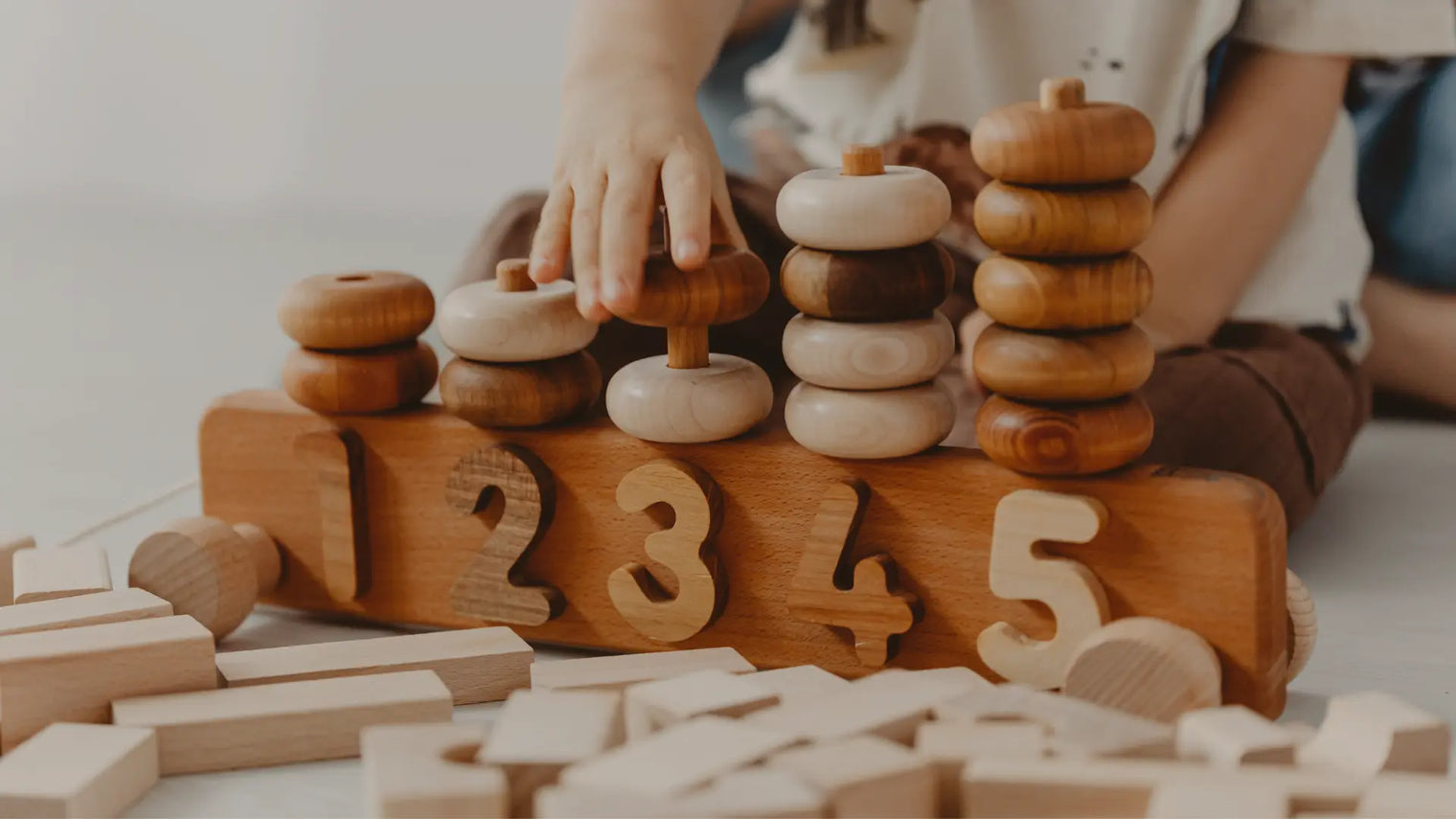 Child playing with a Montessori toy