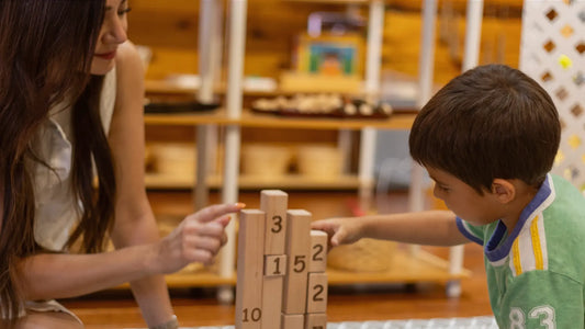 Adult introducing numbers using Montessori approach