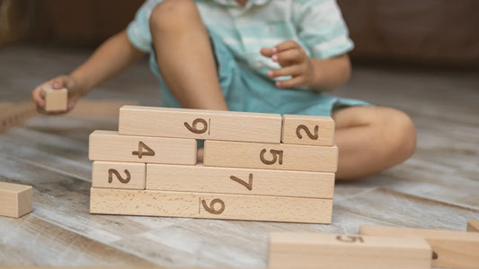 4-year-old boy playing with the number blocks educational toy