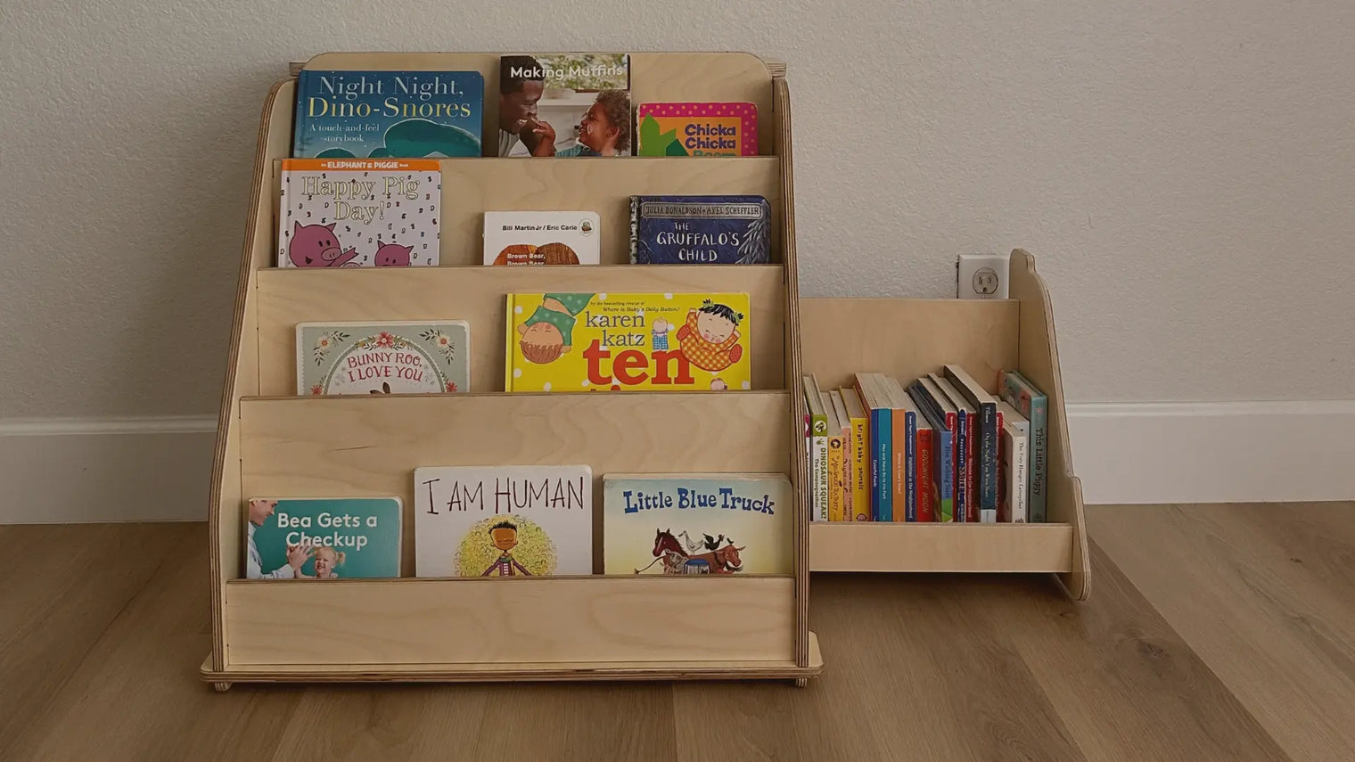 Display of a kid's Montessori bookshelf with hidden storage