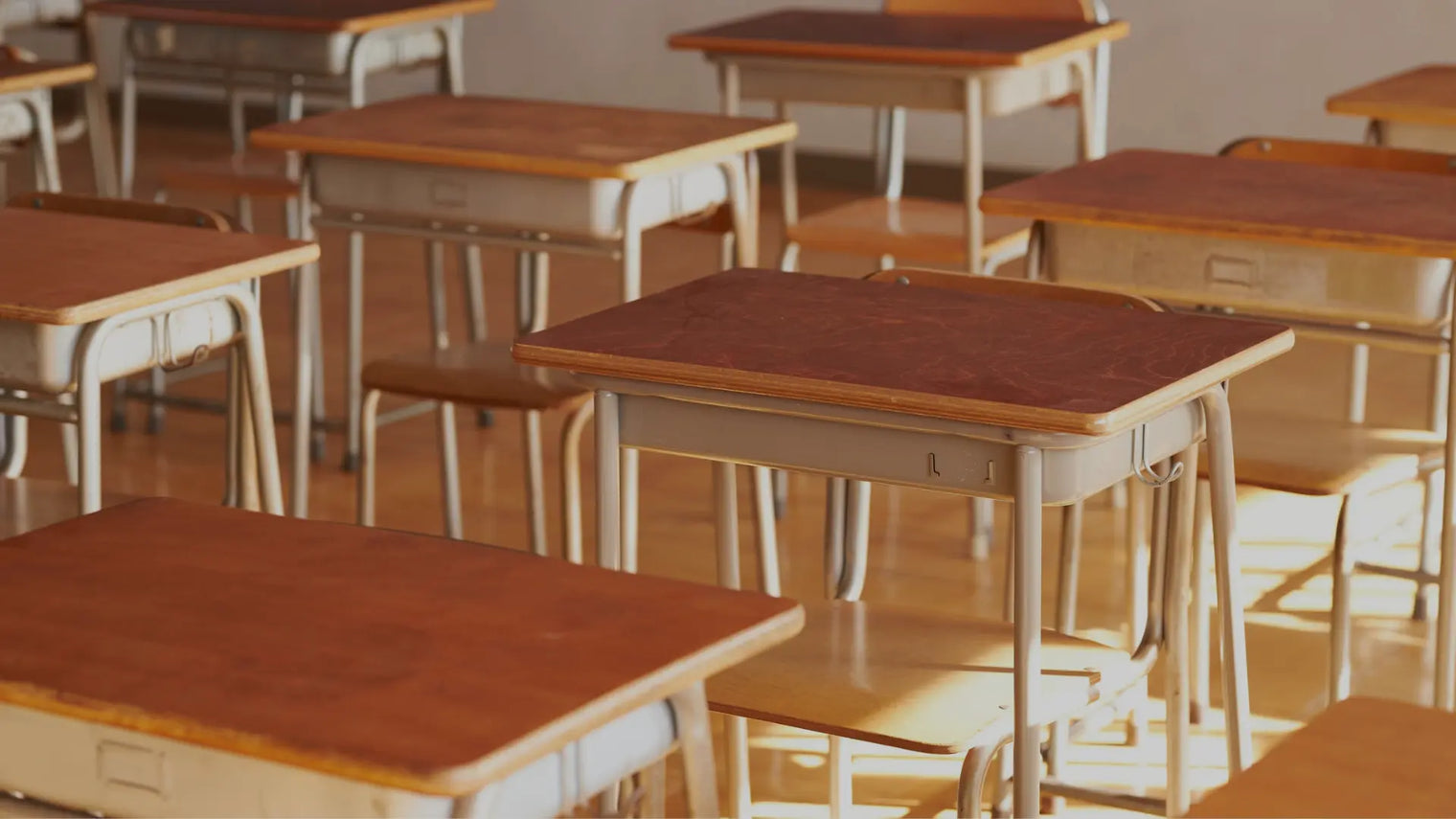 Wooden desks in classroom
