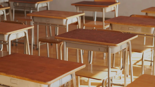 Wooden desks in classroom