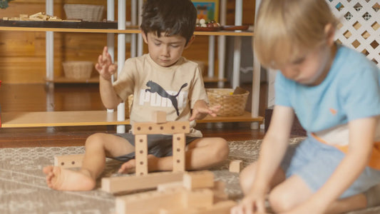 Two boys playing with Montessori Number blocks