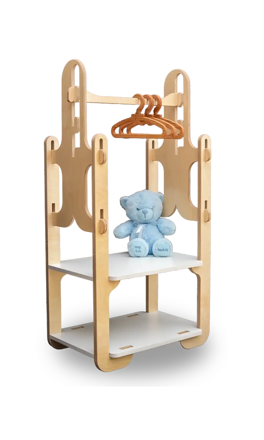 Custom-designed, space-saving wooden toddler clothing rack with hangers and a plush blue teddy bear, crafted by Dannico Woodworks, ideal for stylish nursery organization.