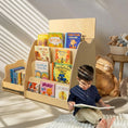 Load image into Gallery viewer, kid reading a book next to a montessori bookshelf
