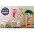 Load image into Gallery viewer, Locally-crafted 'Made in America' wooden clothing rack for kids by Dannico Woodworks, showcasing a straw hat, colorful clothes, and a woven basket, set against a nursery backdrop with educational toys and books.
