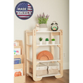 Load image into Gallery viewer, A warm and neatly organized wooden shelf in a child's room, labeled 'Made in America'. The top shelf hosts a lavender plant in a white pot alongside a vintage black alarm clock, while the middle shelf features an array of vibrant green succulents. Below, a classic wooden rainbow toy creates an arc of warm tones, and the bottom shelf houses two fabric storage bins. To the left, a side bookshelf is filled with colorful children's books, contributing to the educational and inviting atmosphere of the space.
