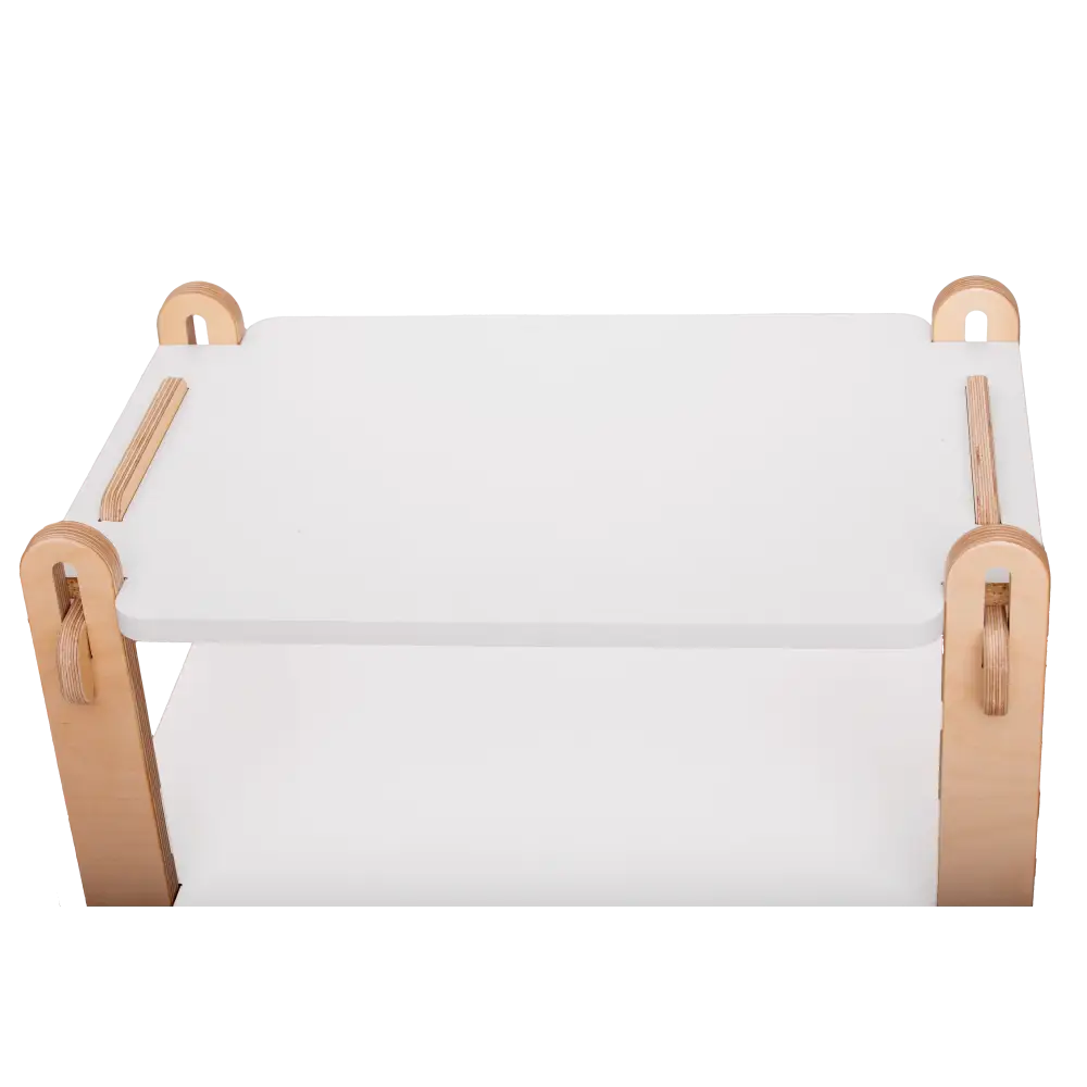 Top-down view of a minimalist children's wooden organizer with a clean, white flat top surface, showcasing the contrast between the natural woodgrain of the rounded corner joints and the smooth white panels. The design focuses on simplicity and functionality, with visible slots and wooden pegs for easy assembly and a safe, sleek design suitable for a child's room.