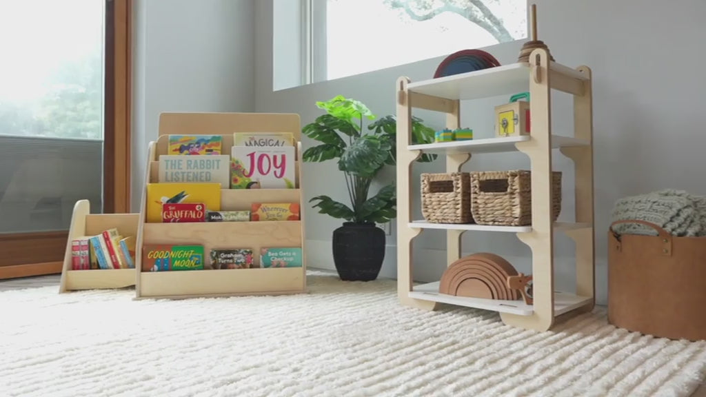 showing how our montessori bookshelf works with its hidden storage and top compartment.