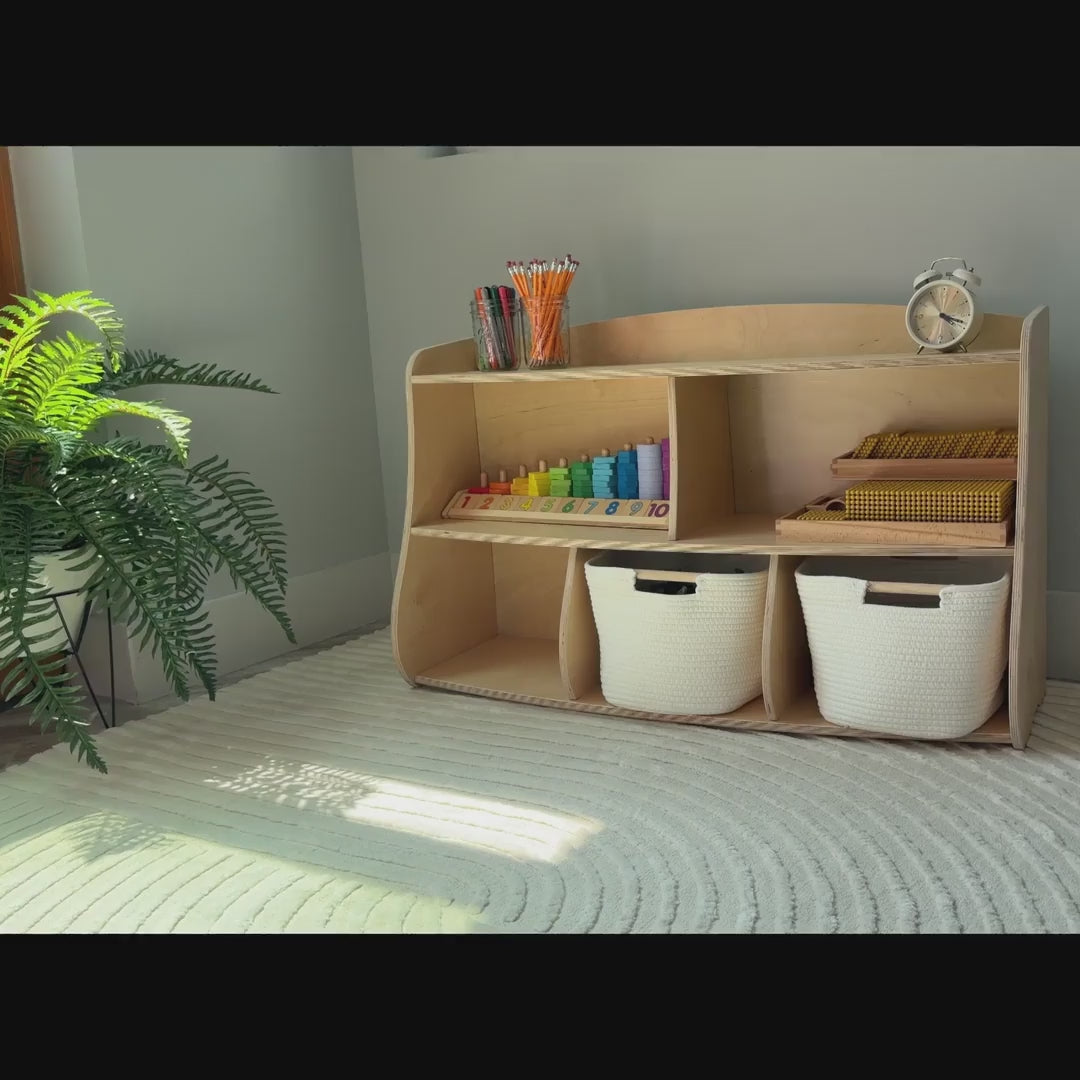 Shows our Montessori Toyshelf in action