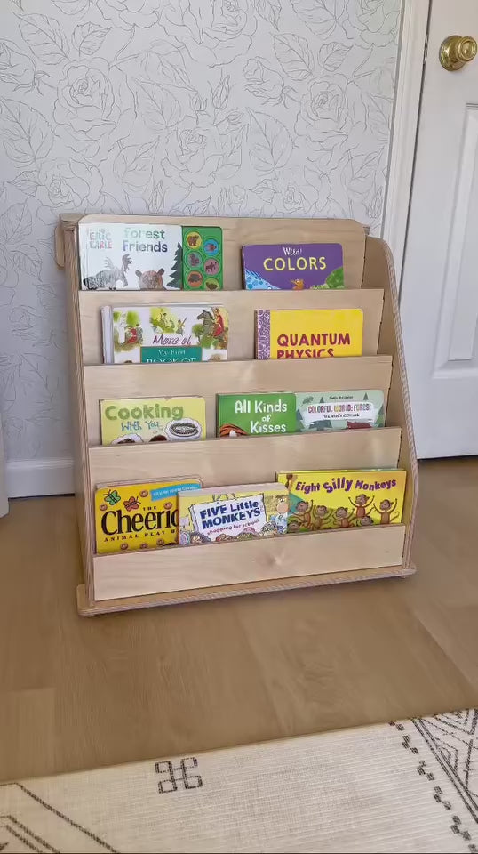 influencer show casing the drawer for our montessori bookshelf